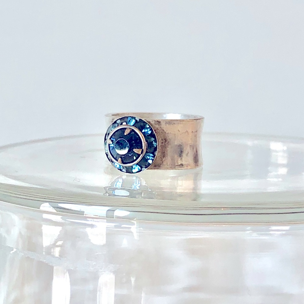 Blue faceted gemstone ring in sterling